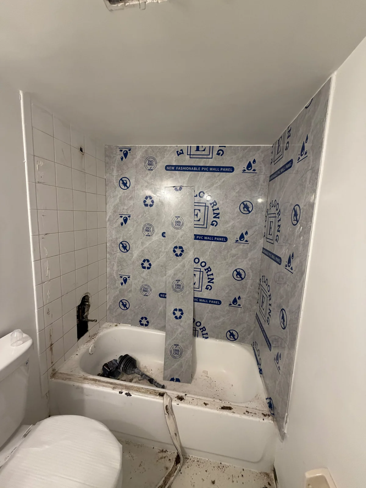 Bathroom · Wall panel installation in progress
